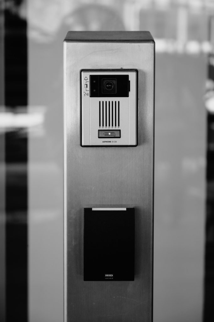 pexels-photo-22710744-22710744 Minimalist black and white photo of an intercom system on a building facade in Boise.
